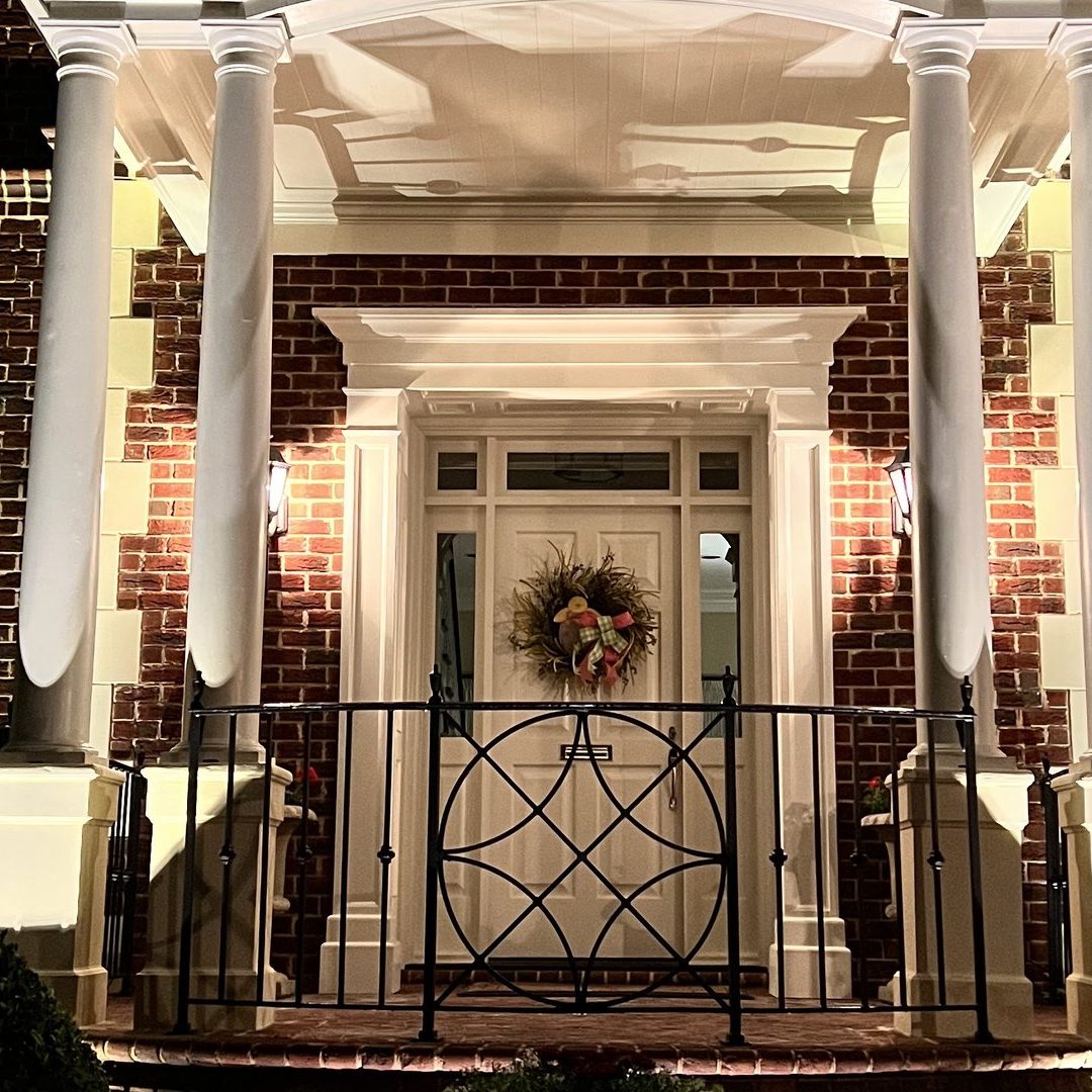 entryway lit with hardscape outdoor lighting, highlighting architecture on an avondale home